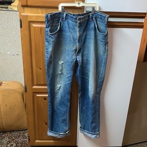 Vintage 90's grungy ripped orange tab Levi’s 40x32